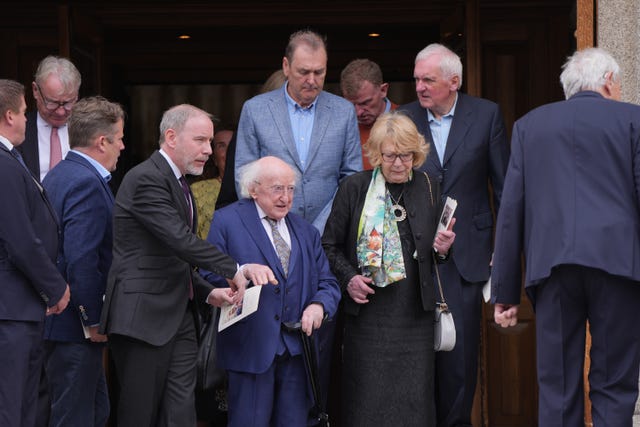 Former Irish president Michael D Higgins, his wife Sabina and Bertie Ahern leaving St John the Baptist Church, Blackrock