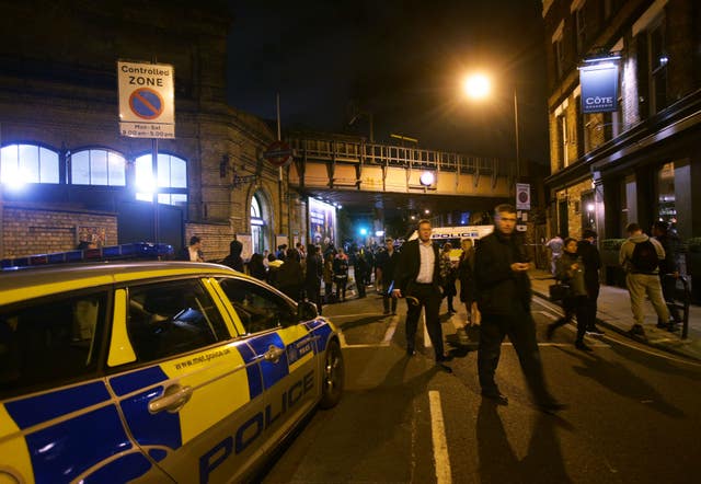 Police at the scene outside Parsons Green Tube station after the stabbings (Yui Mok/PA)