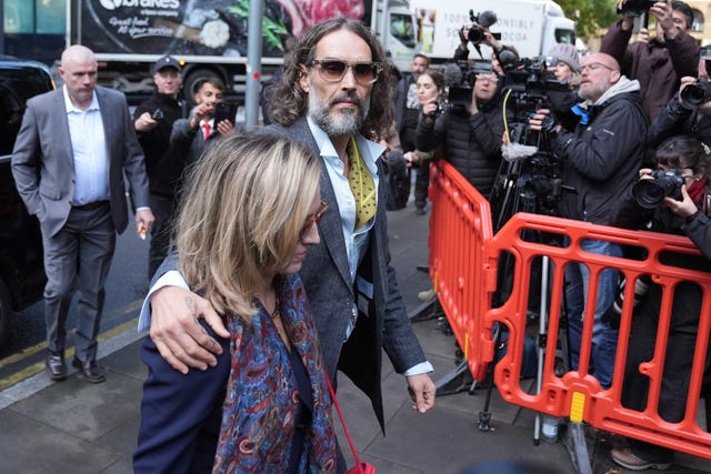 Russell Brand arrives at court with his wife