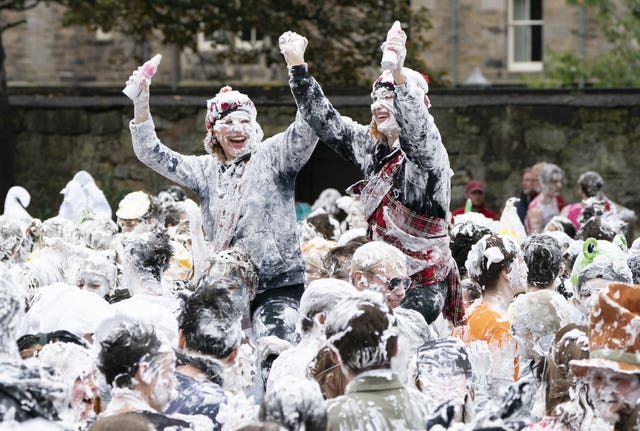Hundreds of students take part in the traditional Raisin Monday foam fight on St Salvator’s Lower College Lawn at the University of St Andrews in Fife