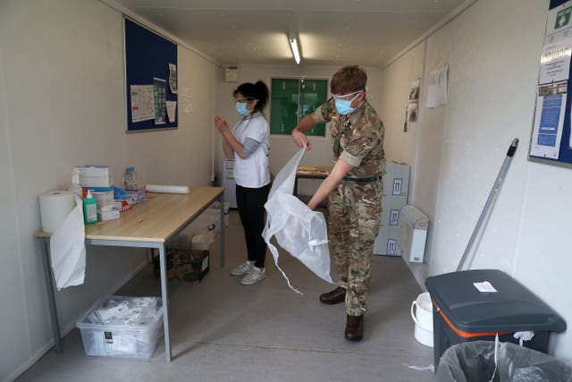 Medic and soldier organising tests
