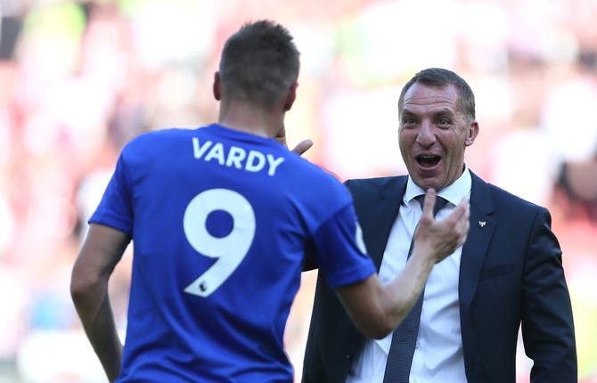 Jamie Vardy, left, is congratulated by Leicester boss Brendan Rodgers