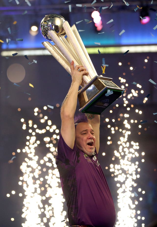 Peter Wright lifts the Sid Waddell Trophy