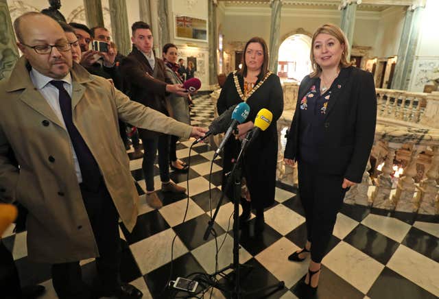 Lord Mayor of Belfast Deirdre Hargey, centre left, and Northern Ireland Secretary Karen Bradley, right, speaking to the media after their meeting at Belfast City Hall about the Primark fire 