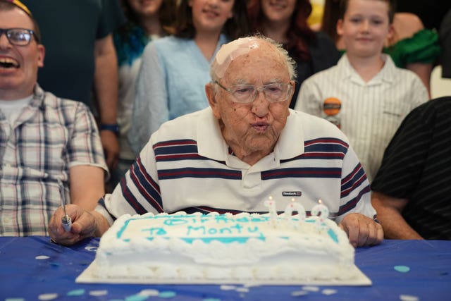 Monty Goldstein with a birthday cake