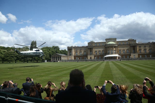 US President Donald Trump and his wife Melania arrive in Marine One at Buckingham Palace