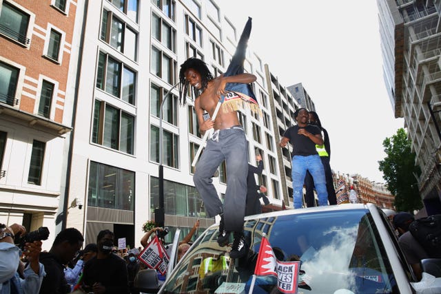 People march in central London after attending a Black Lives Matter rally in Hyde Park