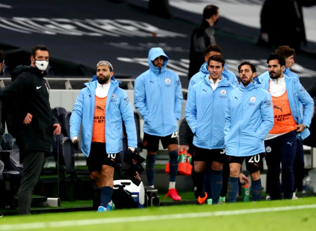 Manchester City's Sergio Aguero, left, remained on the bench for the 2-0 defeat at Tottenham