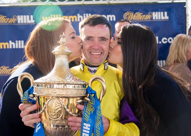 Brando's regular rider Tom Eaves celebrates winning the Ayr Gold Cup