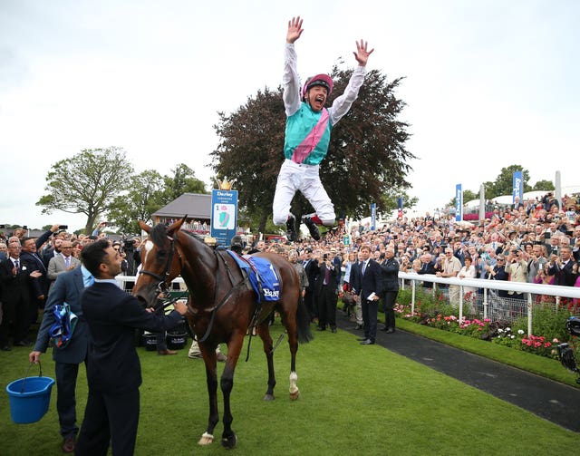 Frankie Dettori performs his flying dismount after the Yorkshire Oaks