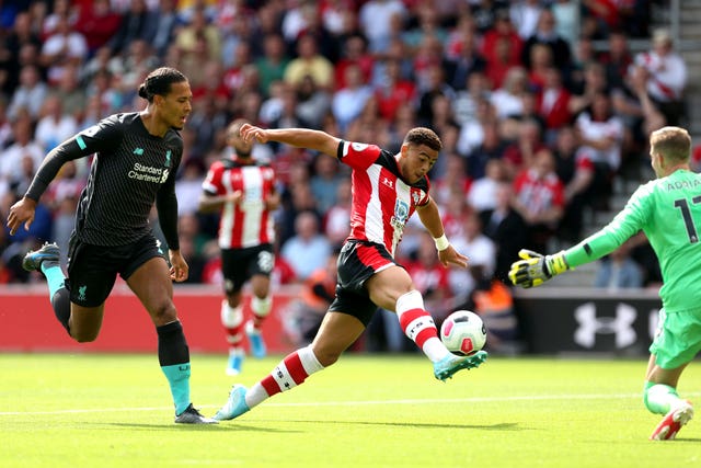 Che Adams, centre, shoots unsuccessfully against Liverpool