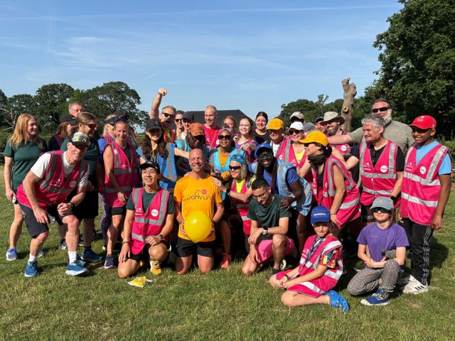 Darren Wood (bottom, second from left) after completing Morden parkrun in south London, his 1,000th parkrun