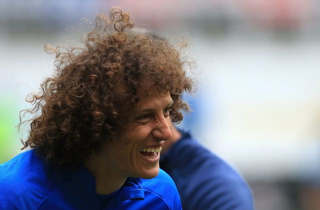 Defender David Luiz laughs during a warm-up for Arsenal.