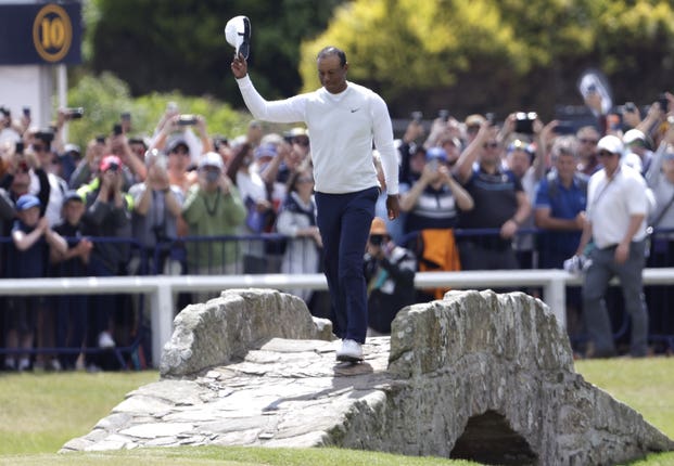 Tiger Woods was given a huge ovation as he made his way up the 18th