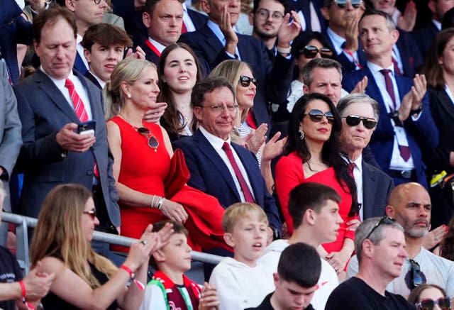 Liverpool chairman Tom Werner, centre, and owner John W Henry, right, in the directors box at Anfield