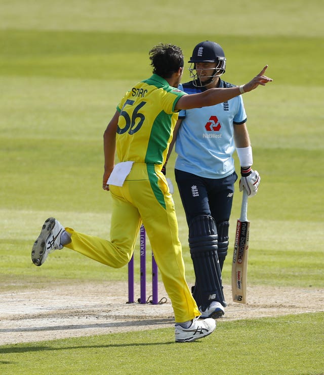 Mitchell Starc celebrates the dismissal of Joe Root