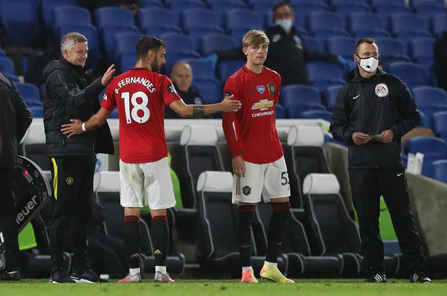 Manchester United manager Ole Gunnar Solskjaer congratulates Bruno Fernandes as he is substituted 