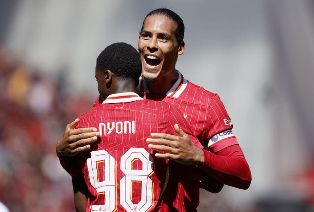 Virgil van Dijk celebrates with Liverpool’s Trey Nyoni