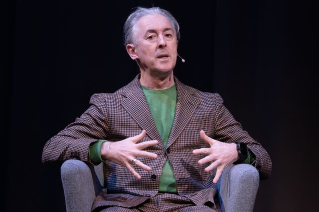 Actor Alan Cumming on stage as he speaks to First Minister and Scottish National Party (SNP) leader John Swinney during event at the Assembly Rooms in Edinburgh ahead of the upcoming Holyrood election