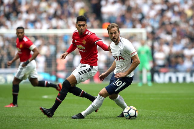 England colleagues Smalling (left) and Kane (right) came up against one another in the FA Cup semi-final
