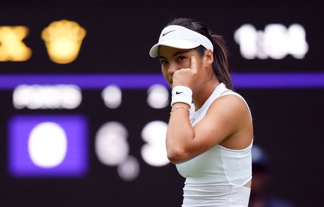 Emma Raducanu points to her head in celebration