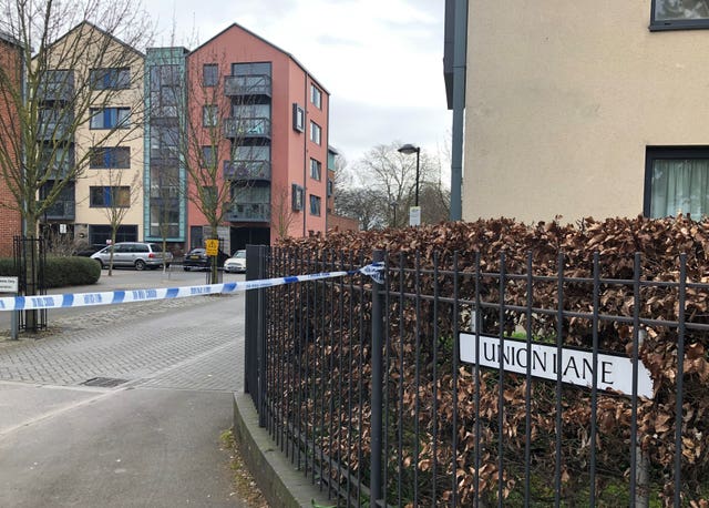 Police at the scene of a fatal stabbing in Isleworth