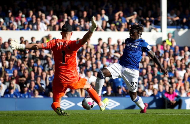 Moise Kean, right, is denied by Dean Henderson