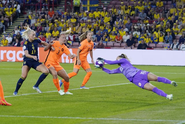 Daphne van Domselaar, right, dives to cut out Johanna Rytting Kaneryd’s cross