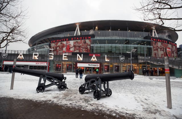 Thousands of football fans braved the conditions to reach the Emirates Stadium for the Premier League match between Arsenal and Manchester City (Nick Potts/PA)