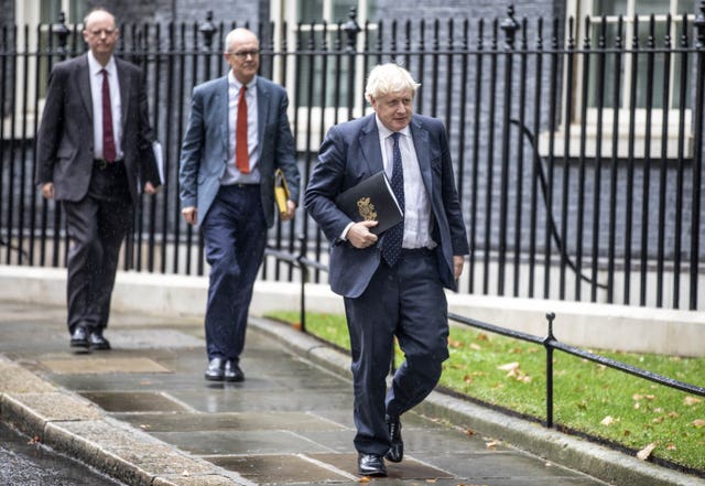 Boris Johnson leads Sir Patrick Vallance and Professor Chris Whitty to the Downing Street news conference