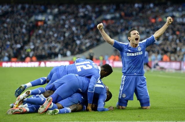 Lampard celebrates a Chelsea goal alongside his team-mates in the FA Cup semi-final win over Tottenham in 2012