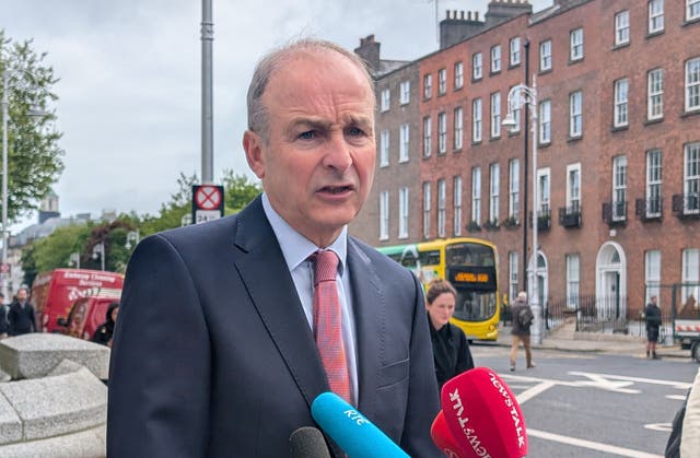 Taosieach Micheal Martin speaking to reporters