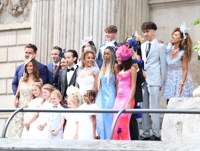 Spice Girl Melanie Brown, Mel B, and her husband hairdresser Rory McPhee stand for photographs with family members following their wedding at St Paul’s Cathedral, London