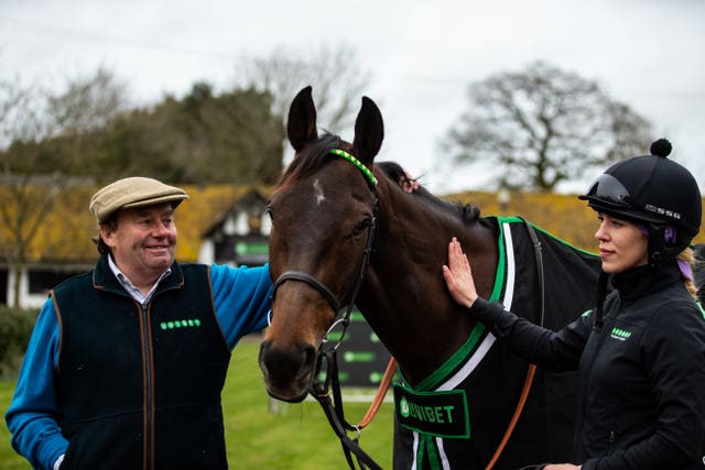 Nicky Henderson (left) with Buveur D’Air and stable hand Hannah Ryan at a media visit to the trainer's Seven Barrows stables
