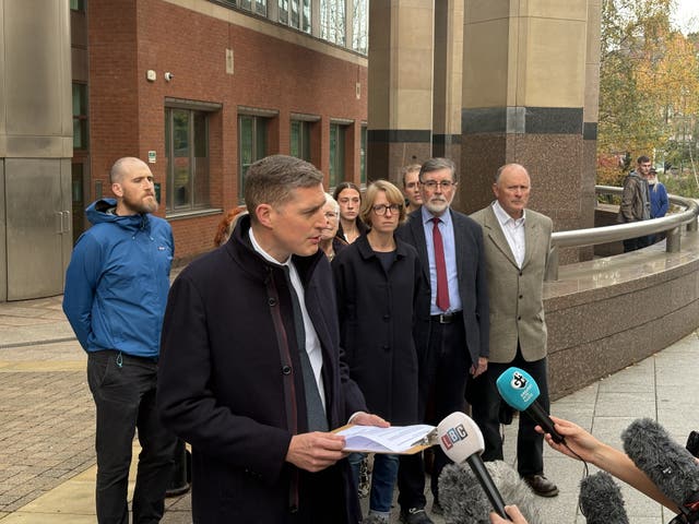Chris Marriott's widow Bryony Marriott (third right) listening as DCI Andy Knowles makes a statement to the media outside Sheffield Crown Court