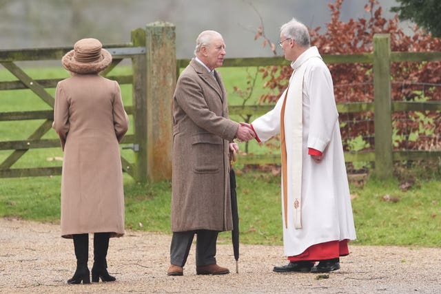 The King and Queen with Reverend Canon Paul Williams after attending St Mary Magdalene, the parish church at Sandringham