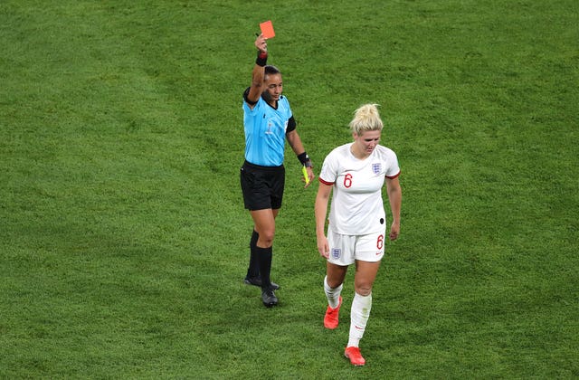 Millie Bright is shown a red card by referee Edina Alves Batista