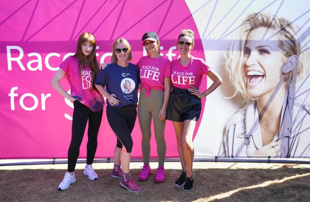 Michelle Mitchell, the chief executive of Cancer Research with the former Girls Aloud band members