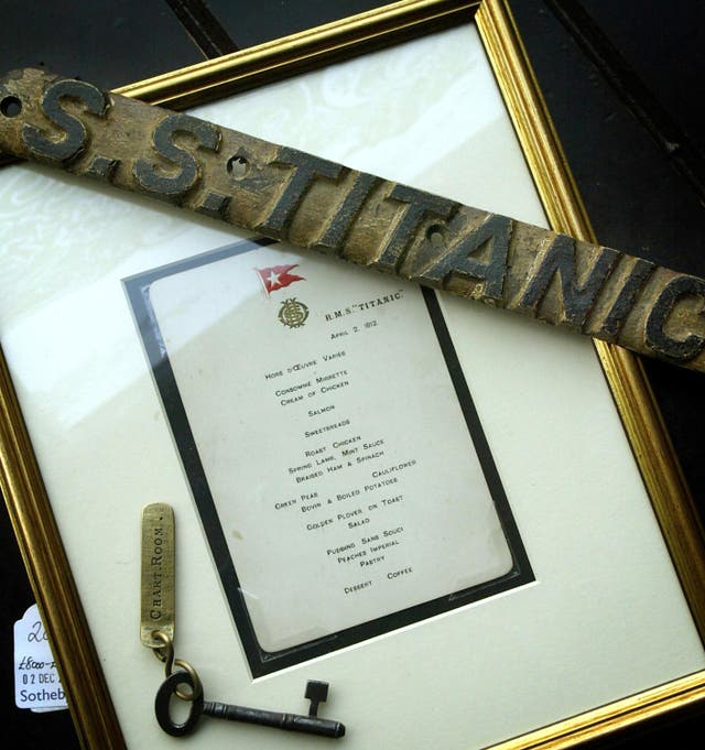 A crew menu card and lifebelt name plate recovered from the wreck of the Titanic 