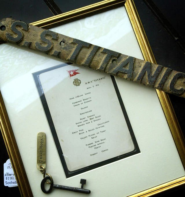 A crew menu card and lifebelt name plate recovered from the wreck of the Titanic