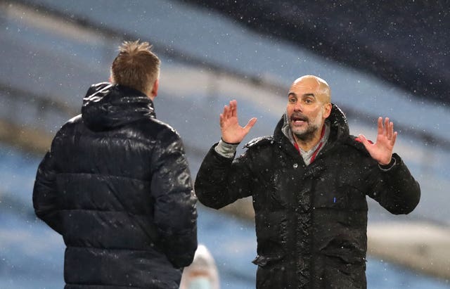 Pep Guardiola (right) believes Manchester City are showing title credentials once again