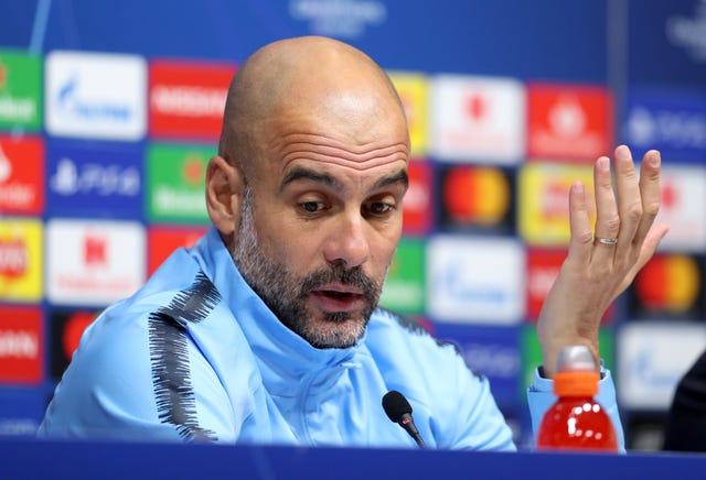 Pep Guardiola talks to the press