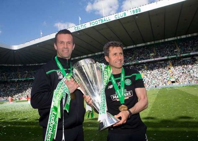 Former Celtic manager Ronny Deila (left) and assistant John Collins with the Scottish Premiership trophy