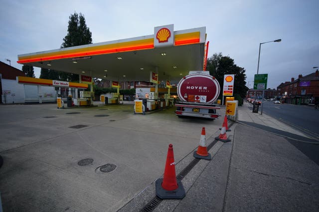 A petrol tanker delivers fuel to a Shell petrol station in Liverpool which was closed due to having no fuel (Peter Byrne/PA)
