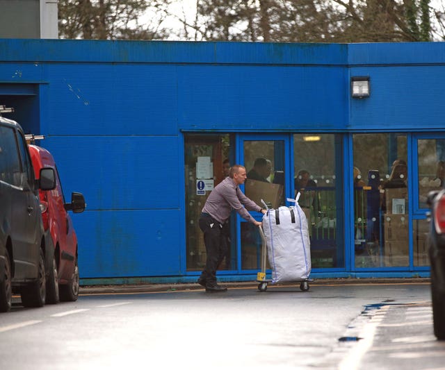 A member of staff at Arrowe Park Hospital in Merseyside prepares for a bus carrying British nationals from the coronavirus-hit city of Wuhan in China