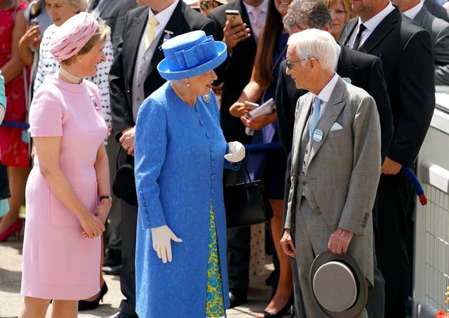 The Queen meets Lester Piggott after unveiling a statue of him in 2019