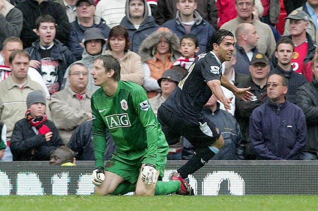 Carlos Tevez, right, celebrates his winner against Manchester United which secured West Ham's Premier League survival