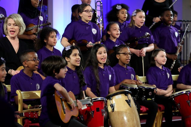 A school choir performs as the Duchess of Cambridge hosts a gala dinner at Buckingham Palace