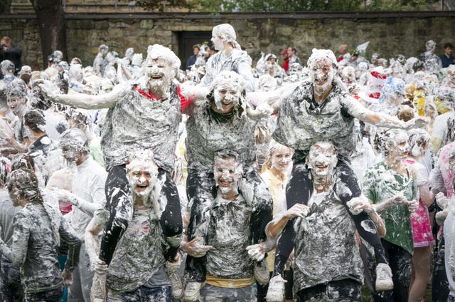 Hundreds of students take part in the traditional Raisin Monday foam fight on St Salvator’s Lower College Lawn at the University of St Andrews in Fife 