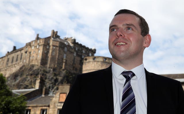 Douglas Ross with Edinburgh Castle in the background